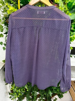 Blusa con estampado geométrico y cremallera
