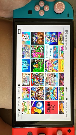 Nintendo Switch OLED + Bundle Accessori e Giochi