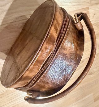 Bolso bombonera redondo piel efecto serpiente