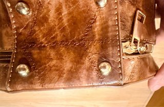Bolso bombonera redondo piel efecto serpiente