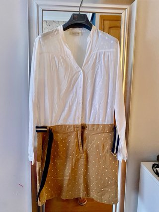 Vestido lunares blanco y marrón la parte de abajo.