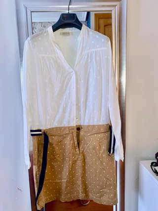 Vestido lunares blanco y marrón la parte de abajo.