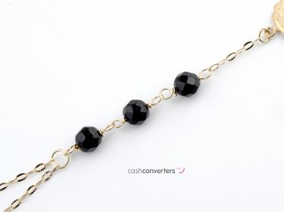 manita oro 18k con piedra con onix