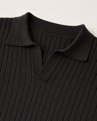 Polo de punto acanalado negro manga larga