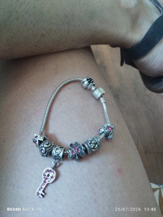 Pulsera plata con charms y circonitas rosas