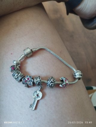Pulsera plata con charms y circonitas rosas
