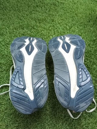 Zapatillas running Saucony blancas y naranjas