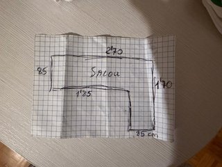 Sofá cama gris y rosa
