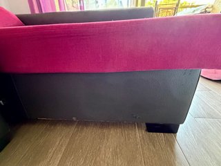 Sofá cama gris y rosa