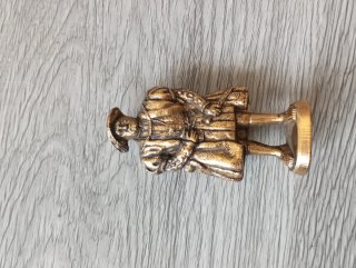 Scultura in metallo dorato