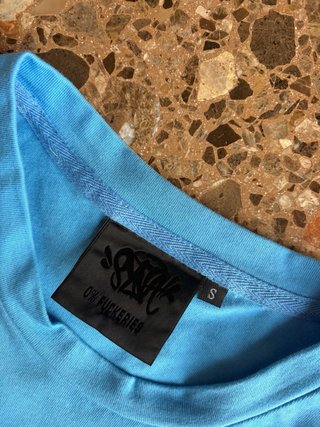 Camiseta Syna World azul – Como nueva