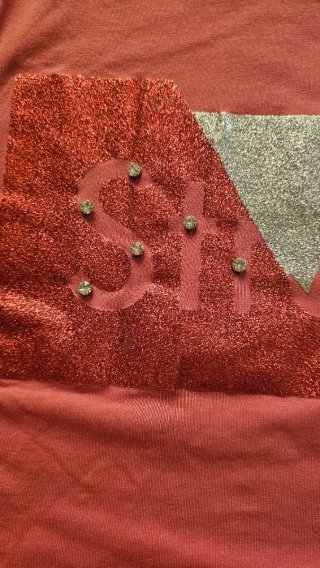 Maglia con maniche a sbuffo e dettagli glitterati