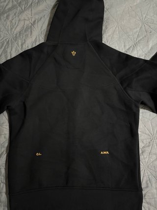 Conjunto Nike NOCTA Negro/Dorado