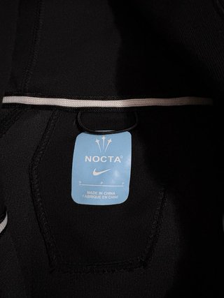 Conjunto Nike NOCTA Negro/Dorado