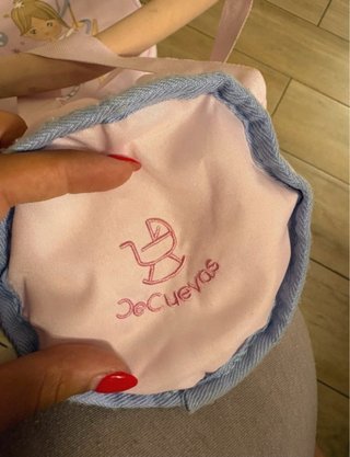 Carrito de muñecas rosa con estrellas