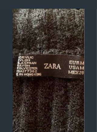 Jersey Zara sin mangas negro y dorado