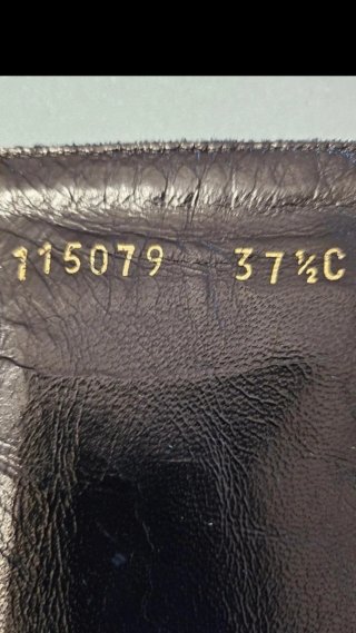 Stivaletti Gucci neri con fibbia e catena