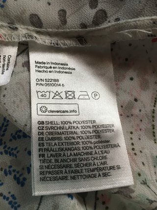 Camicia velata fiori senza maniche.
