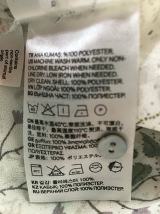 Camicia velata fiori senza maniche.