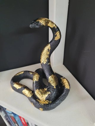Serpente decorativo Art Déco nero e oro