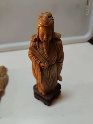 Statue cinesi in pietra beige/marrone