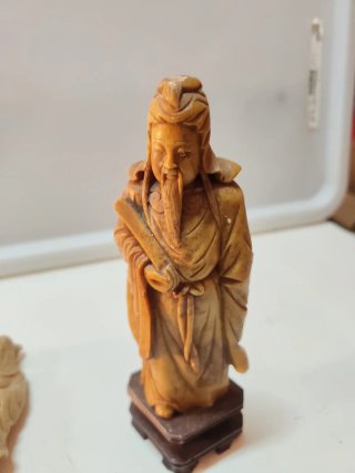 Statue cinesi in pietra beige/marrone
