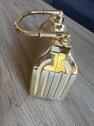 Bolso de mano fiesta rígido dorado