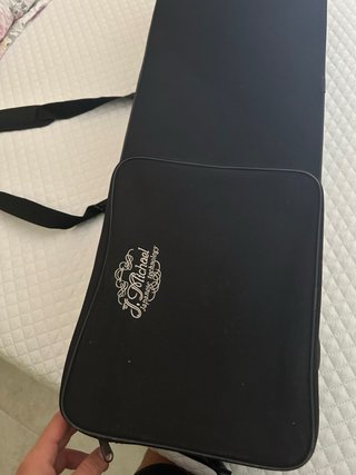 Trombón dorado con funda