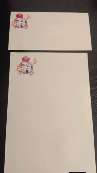 Papel de carta y sobres con dibujo de reloj