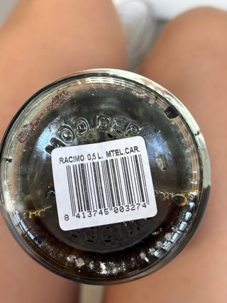 Botella sellada  con forma de racimo de uvas