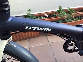 Bicicleta plegable Btwin con cesta