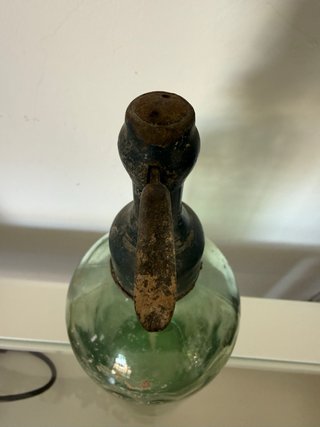 Sifón antiguo cabeza de plomo