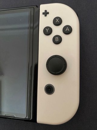 Nintendo Switch OLED Blanca y Negra + Juegos