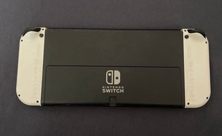 Nintendo Switch OLED Blanca y Negra + Juegos