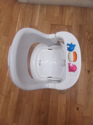 Asiento de baño para bebé con juguetes