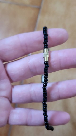 Collana etnica perline nere e cubi bianchi