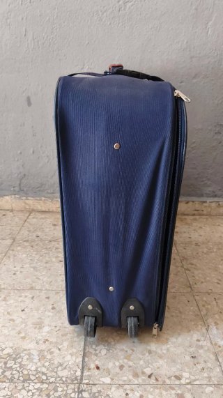 Maleta grande de tela azul y marrón