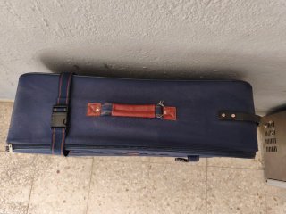 Maleta grande de tela azul y marrón