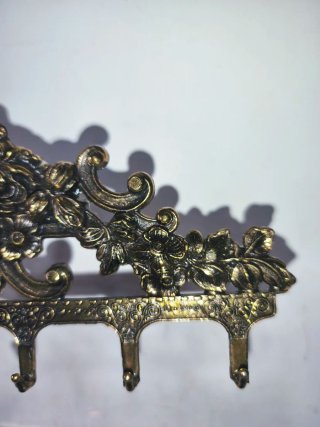 Perchero antiguo diseño floral bronce
