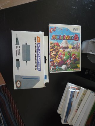 Nintendo Wii + Volante y 9 Juegos, versión america