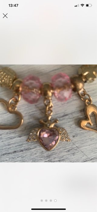 Pulseira dourada com cristais rosa