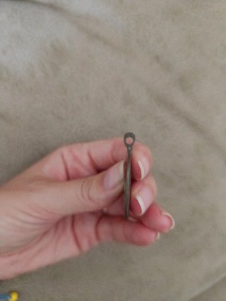 Medalla antigua con figura religiosa