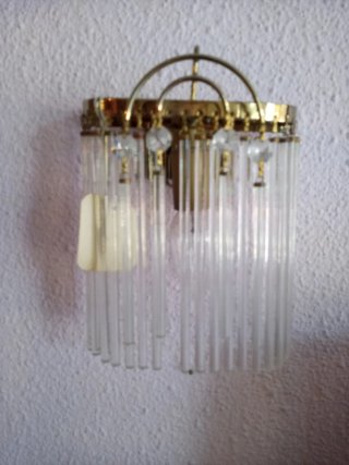 Apliques de pared de cristal y metal dorado