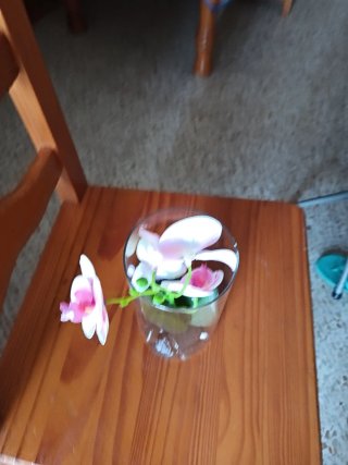 Orquídea artificial en tarro de cristal
