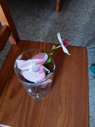 Orquídea artificial en tarro de cristal