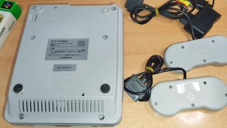 Super Famicom con 2 mandos y juego simcity