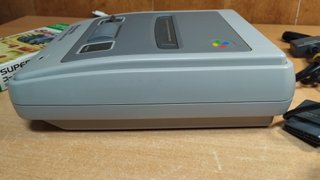 Super Famicom con 2 mandos y juego simcity