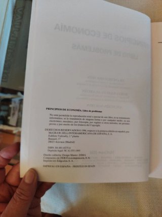 Principios de economía : libro de problemas