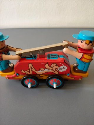 Juguete hojalata mecánico perro y niños