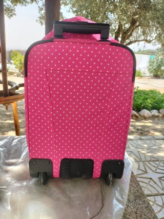 Mochila rosa lunares blancos